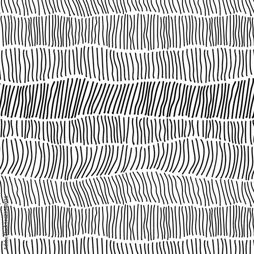 Endless pattern of black hand drawn vertical stripes arranged in uneven casual rows against white background. Minimalist boho vector seamless pattern for textiles and interior.