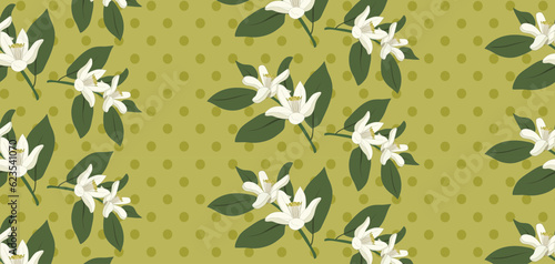 Vintage seamless floral pattern, citrus blossoming branches and polka dots on greenish yellow background. Repeat surface design for wallpaper, textiles, packaging. photo