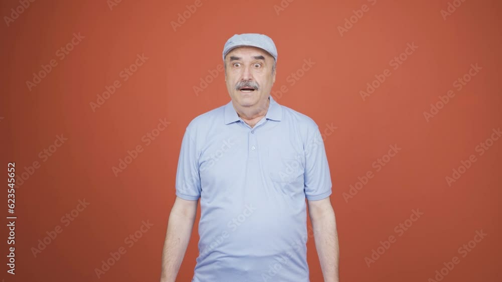 Old man looking at camera in amazement. Old man looking at camera in amazement.
