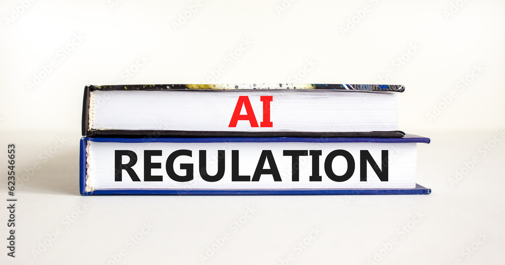 AI regulation symbol. Concept words AI artificial intelligence regulation on beautiful books. Beautiful white background. Business AI artificial intelligence regulation concept. Copy space
