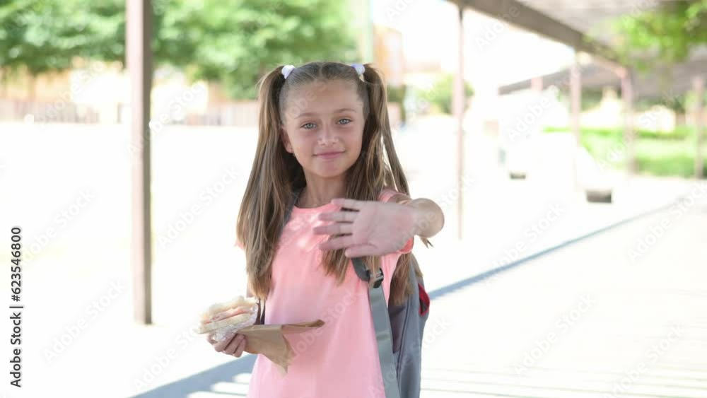 Handheld Clip Of A Beautiful Blonde Girl With Blue Eyes Saying Goodbye. Back to school. Handheld Clip Of A Beautiful Blonde Girl With Blue Eyes Saying Goodbye. Back to school.