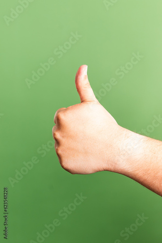 thumb up on green background