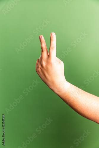 hand showing peace sign