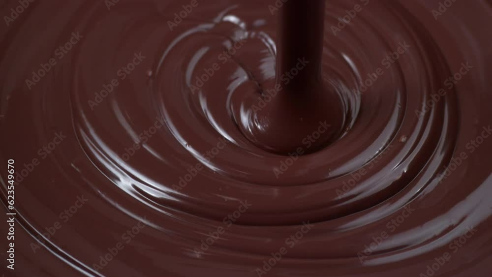 Chocolate pouring in slow motion Chocolate pouring in slow motion