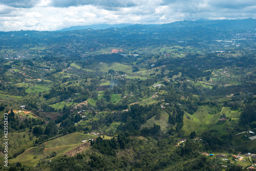 Aerial View of Rionegro Mountains, Hills, Trees, Farms, Houses and Small Facilities in the Countryside near Medellin, Antioquia, Colombia