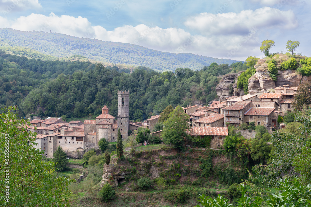 Old stone village in a town of Catalonia in Spain. Village in the mountains surrounded by trees
