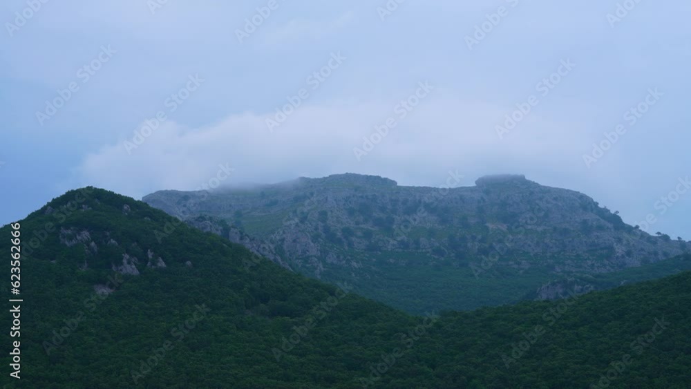 Time lapse of clouds, mists and Cantabrian holm oak on Mount Candina in the town of Liendo, Liendo Valley, Montaña Oriental Costera, Cantabrian Sea, Cantabria, Spain, Europe Time lapse of clouds, mists and Cantabrian holm oak on Mount Candina in the town of Liendo, Liendo Valley, Montaña Oriental Costera, Cantabrian Sea, Cantabria, Spain, Europe