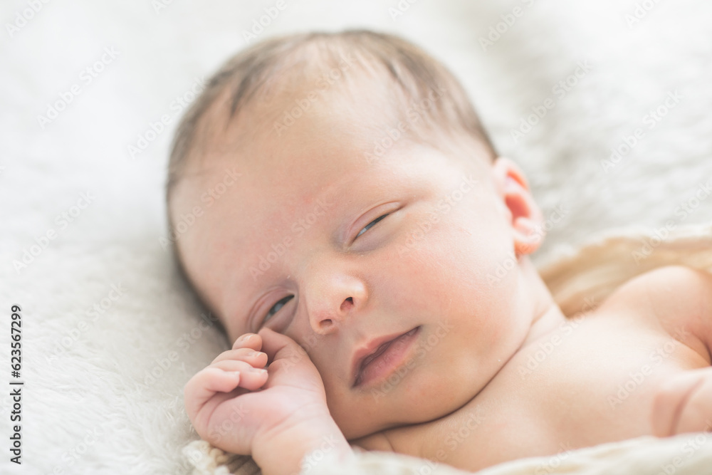 Cute baby sleeping 5 days old on light blanket. Banner design with space for text Cute baby sleeping 5 days old on light blanket. Banner design with space for text