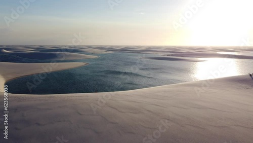 Drone shot of fresh rain water lagoons with white sand at Lencois maranhenses national park in Brazil. photo
