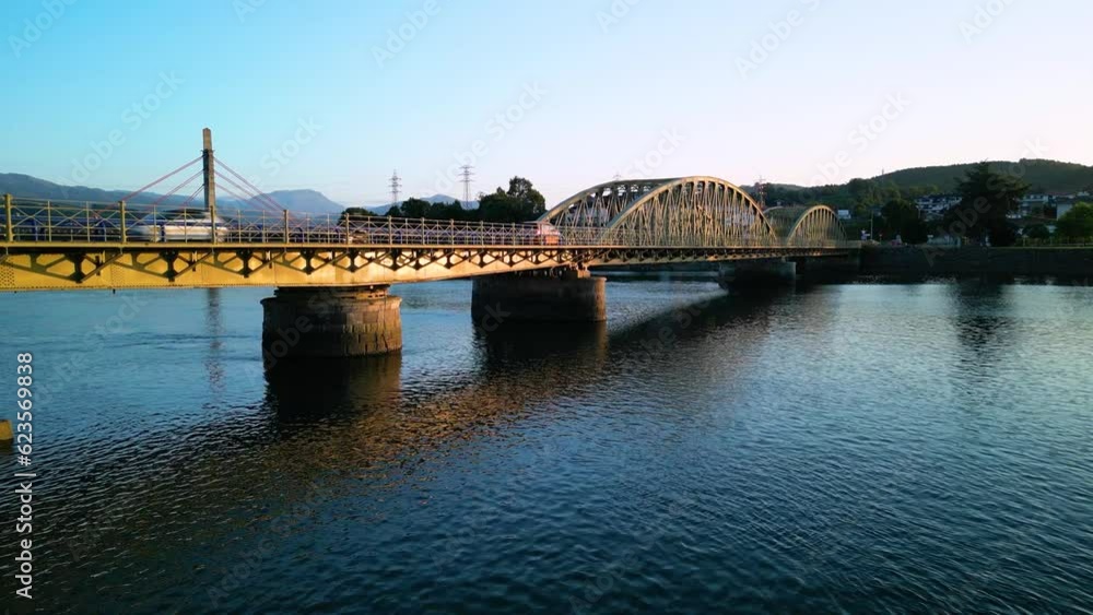 Bridge in the estuary in the port of Colindres fishing and sports port in the Marismas de Santoña, Victoria y Joyel Natural Park. Cantabrian Sea, Cantabria, Spain, Europe Bridge in the estuary in the port of Colindres fishing and sports port in the Marismas de Santoña, Victoria y Joyel Natural Park. Cantabrian Sea, Cantabria, Spain, Europe