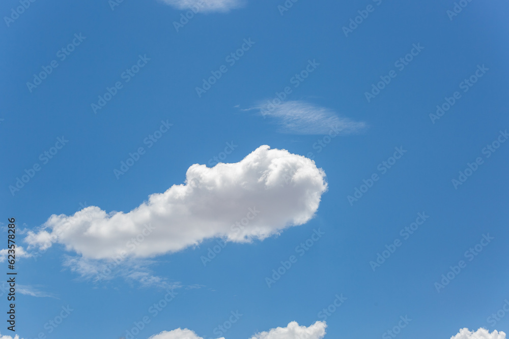 Cloudscapes, beautiful puffy white clouds in the sky above the Sonoran Desert, waiting on monsoon storms to develop. Gorgeous heaven like cloudy skies with intense blue color. Tucson, Arizona, USA. Cloudscapes, beautiful puffy white clouds in the sky above the Sonoran Desert, waiting on monsoon storms to develop. Gorgeous heaven like cloudy skies with intense blue color. Tucson, Arizona, USA.
