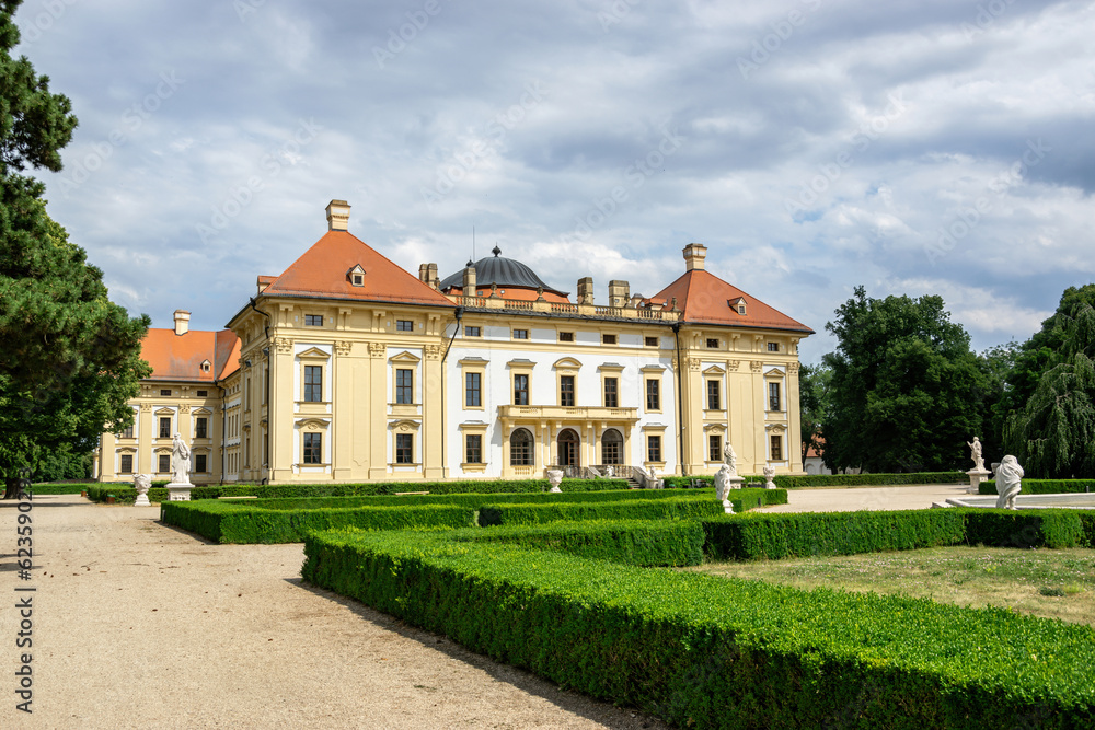 Slavkov Castle (Austerlitz) with a park with statues and a path, Czech Republic.