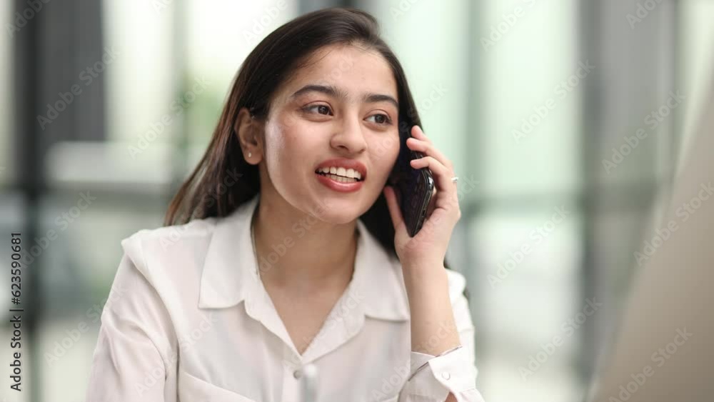 Portrait of young business woman with glasses ofand talking on mobile phone Portrait of young business woman with glasses ofand talking on mobile phone
