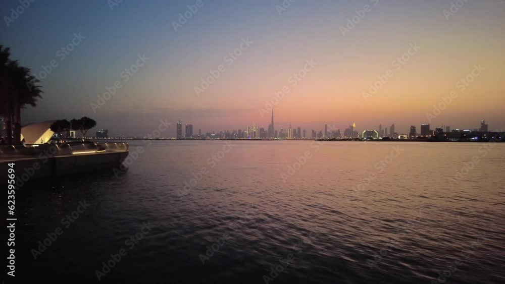 Cityscape of Dubai at sunset, view from the seaside Cityscape of Dubai at sunset, view from the seaside