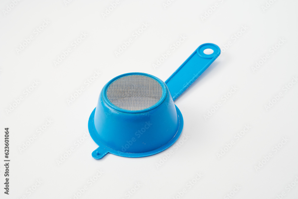 Blue plastic colander tea strainer on white background
Blue plastic colander tea strainer on white background