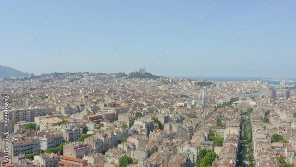 Aerial shot of Marseille in the sunlight with the church of Notre-Dame-de-la-Garde, in France Aerial shot of Marseille in the sunlight with the church of Notre-Dame-de-la-Garde, in France