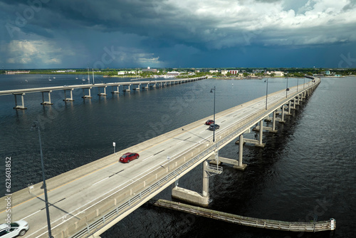 Wallpaper Mural Barron Collier Bridge and Gilchrist Bridge in Florida with moving traffic. Transportation infrastructure in Charlotte County connecting Punta Gorda and Port Charlotte over Peace River Torontodigital.ca