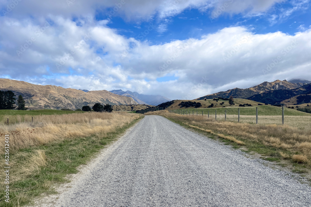 Driving through an agricultural rural sheep farm station in the highlands of the Southern alps