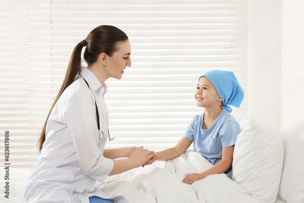 Childhood cancer. Doctor and little patient in hospital Childhood cancer. Doctor and little patient in hospital