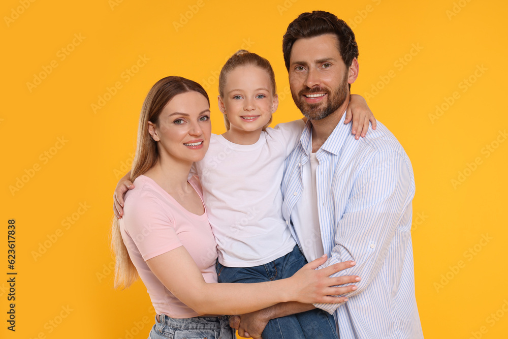 Portrait of happy family on orange background Portrait of happy family on orange background