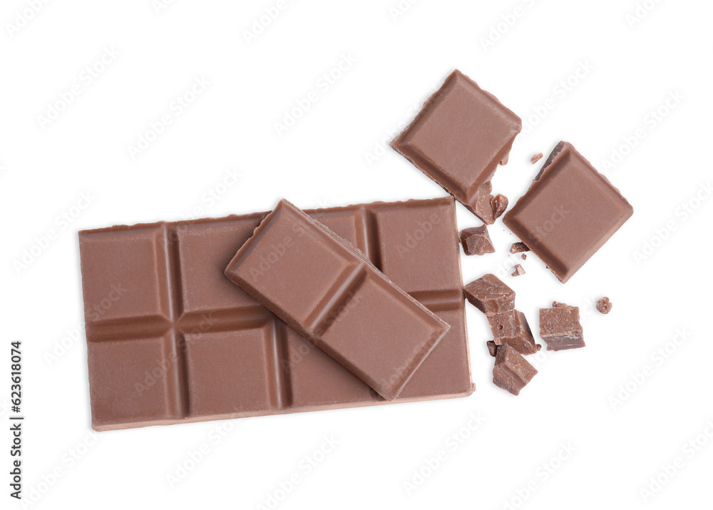 Pieces of delicious milk chocolate bar on white background, top view Pieces of delicious milk chocolate bar on white background, top view