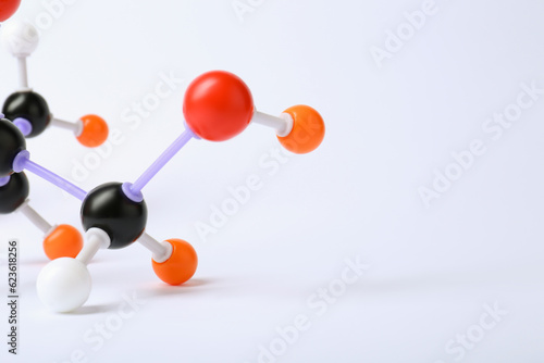 Molecule of sugar on white background, closeup. Chemical model