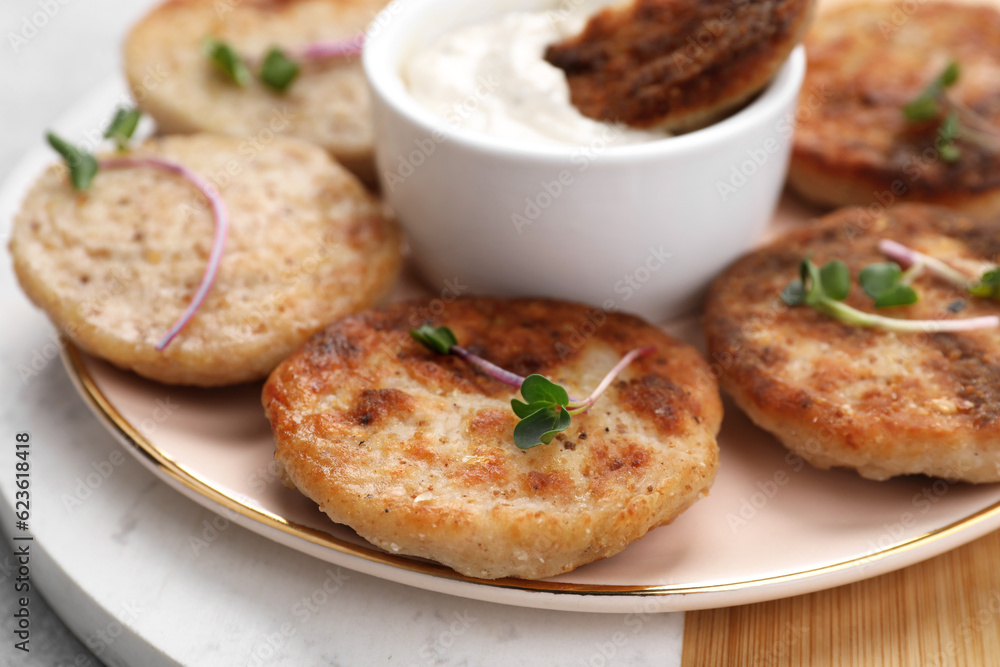 Delicious vegan cutlets and sauce on table, closeup Delicious vegan cutlets and sauce on table, closeup
