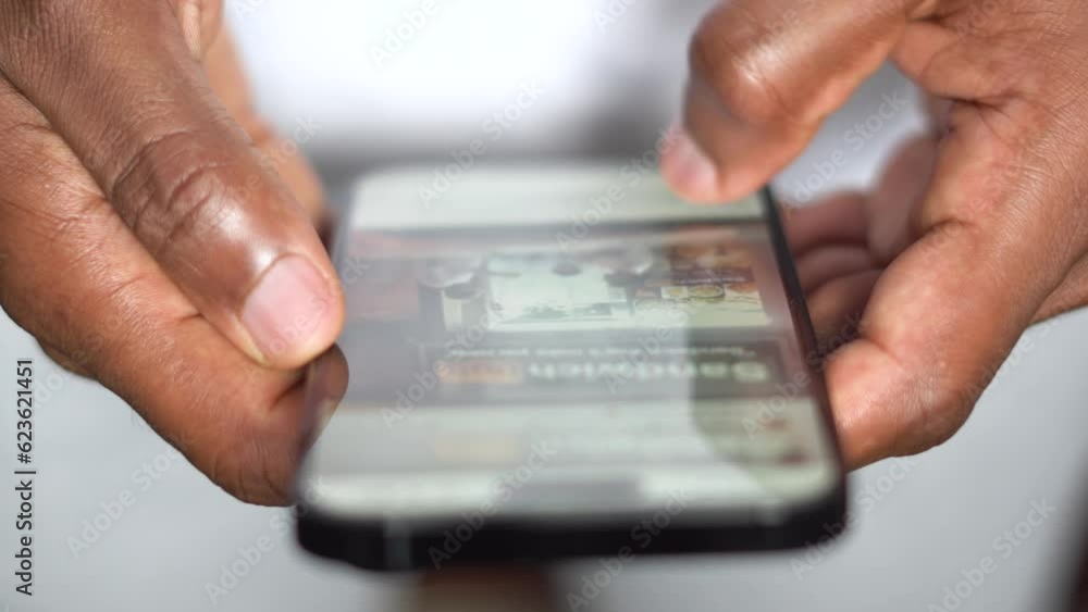 Finger touching scroll page app on mobile phone. Social media and marketing concept Finger touching scroll page app on mobile phone. Social media and marketing concept
