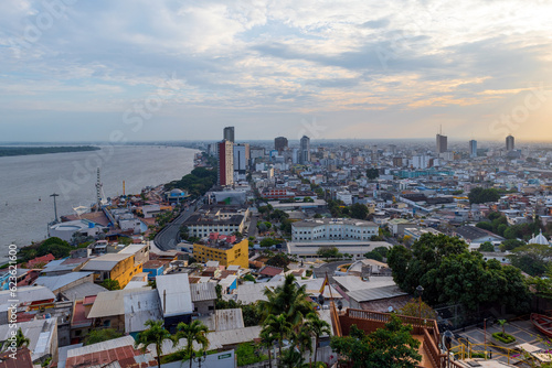 Guayaquil city at sunset with Guayas river and skyscraper skyline cityscape, Guayaquil, Ecuador.