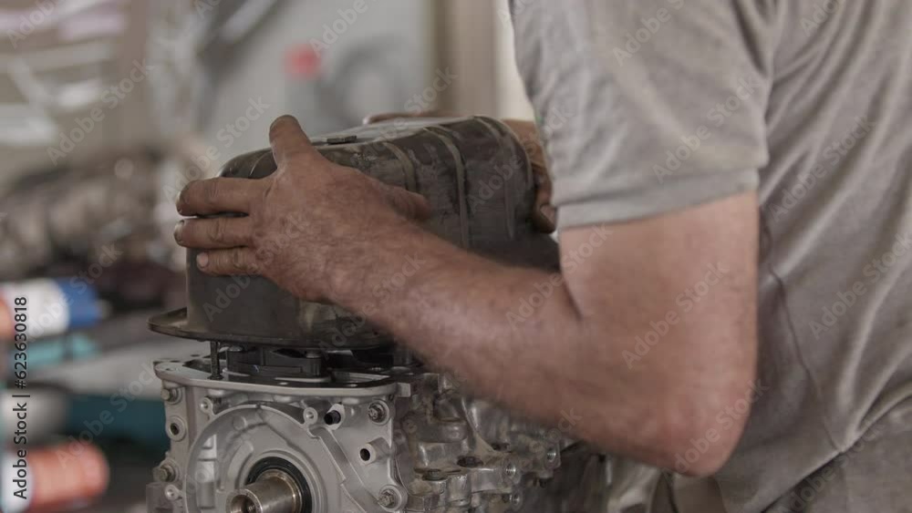 Car Engine Crankcase Cover Replacement in the Repair Shop Footage. Car Engine Crankcase Cover Replacement in the Repair Shop Footage.