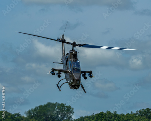 Cobra attack helicopter in flight head on nose down