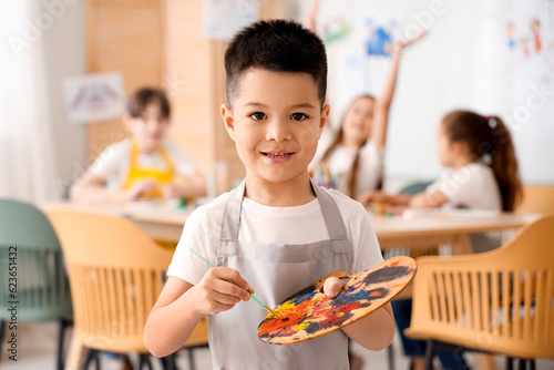 Cute little boy with paint ...