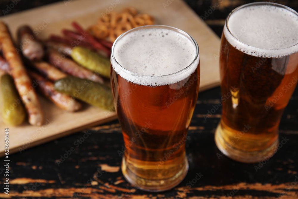 Glasses of cold beer on dark wooden background. Oktoberfest celebration Glasses of cold beer on dark wooden background. Oktoberfest celebration