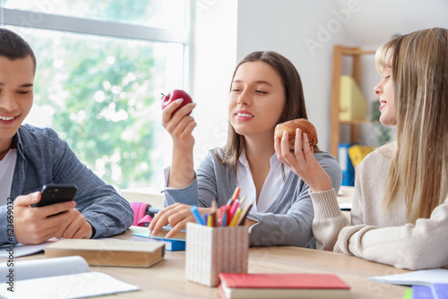 Group of teenage students h...