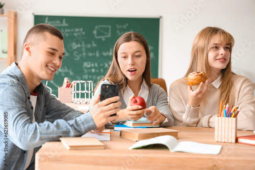 Group of teenage students h...