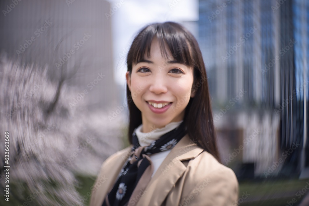 A swirly portrait of Japanese woman behind cherry blossom closeup A swirly portrait of Japanese woman behind cherry blossom closeup