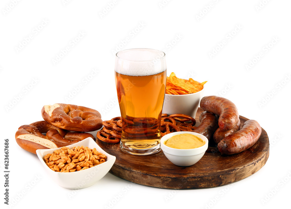 Glass of cold beer and plate with different snacks on white background. Oktoberfest celebration Glass of cold beer and plate with different snacks on white background. Oktoberfest celebration