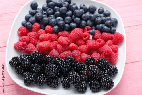 Fresh mixed berries on whit...