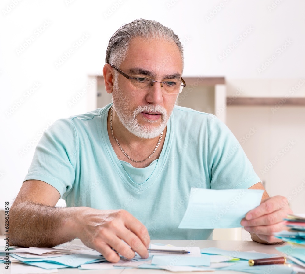 White bearded old man in budget planning concept White bearded old man in budget planning concept