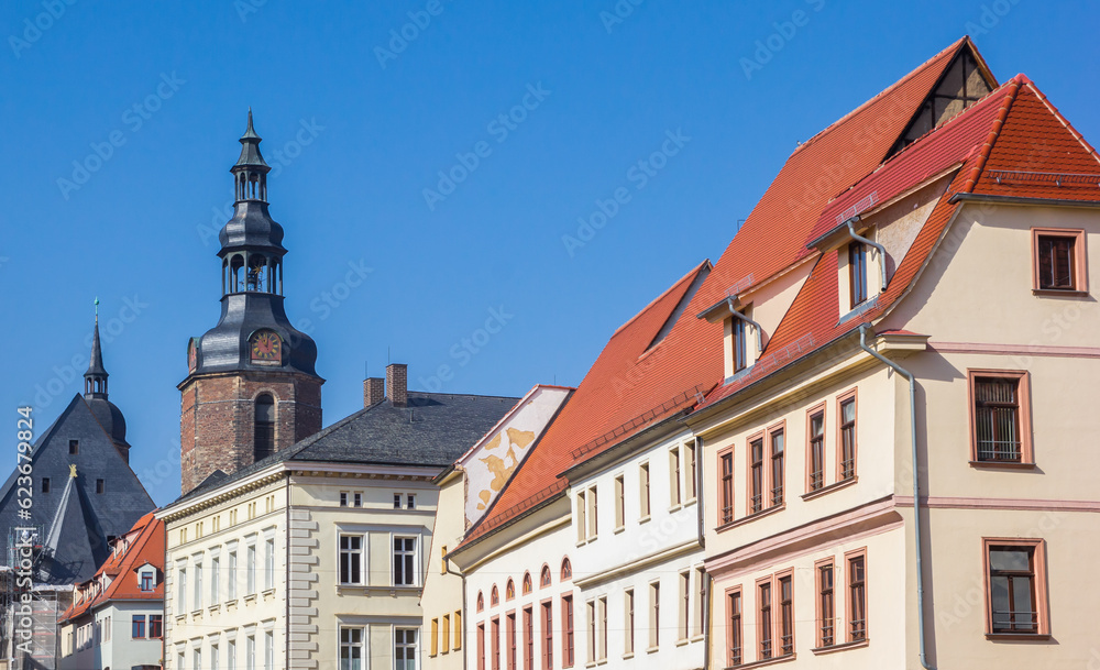 Old houses and church tower at the market square of Eisleben, Germany