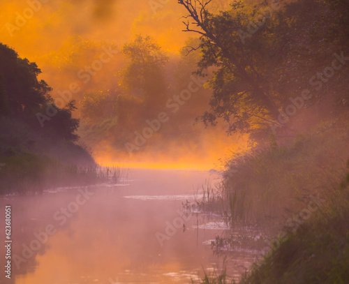 Golden Dawn: Majestic Misty Sunrise over a River Landscape in Northern Europe © dachux21