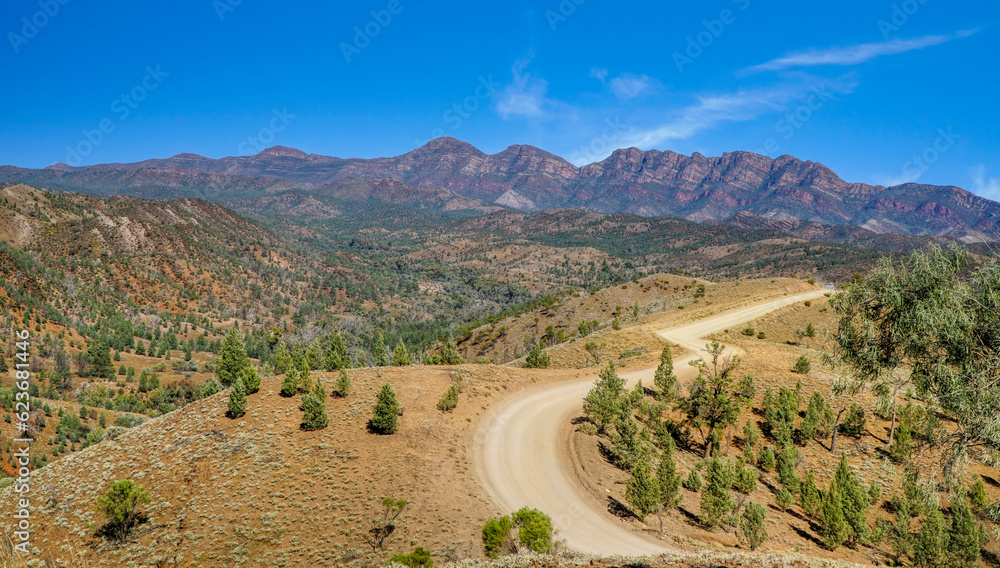 ranges with a dirt road in the foreground