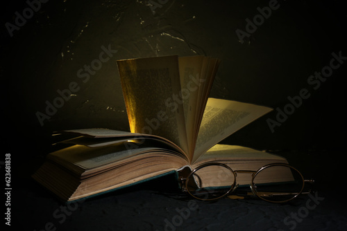 Book with glowing light and...
