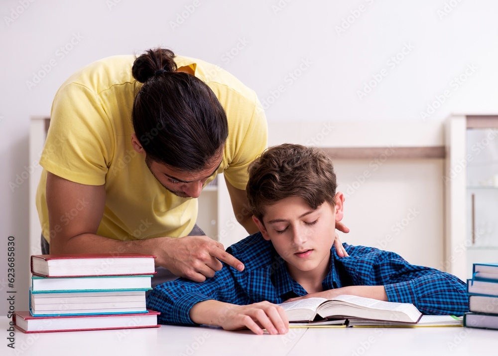 Father helping his son to prepare for school Father helping his son to prepare for school