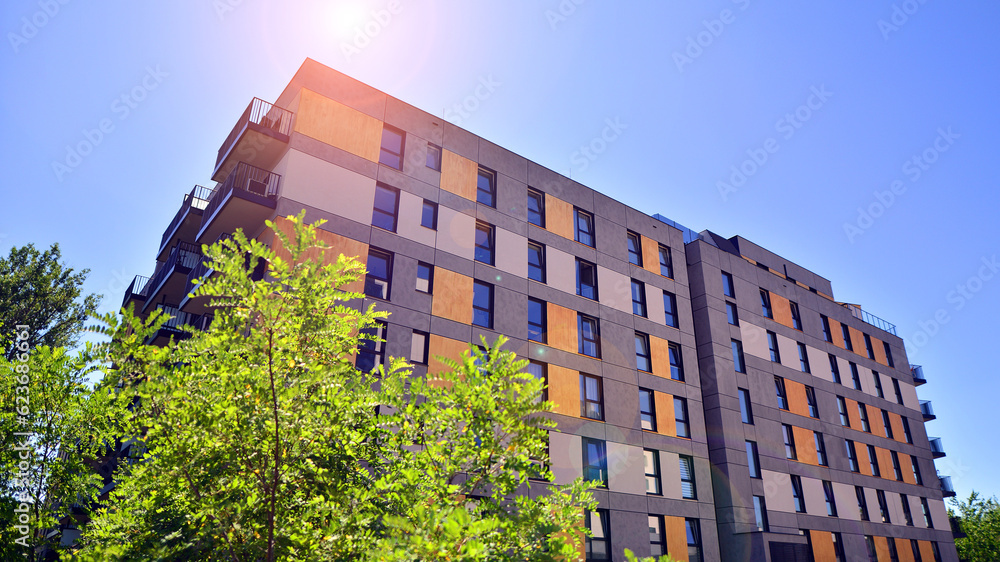 A modern residential building in the vicinity of trees. Ecology and ...