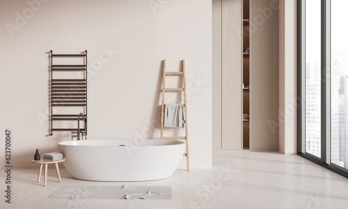 Beige bathroom interior with tub and shelves