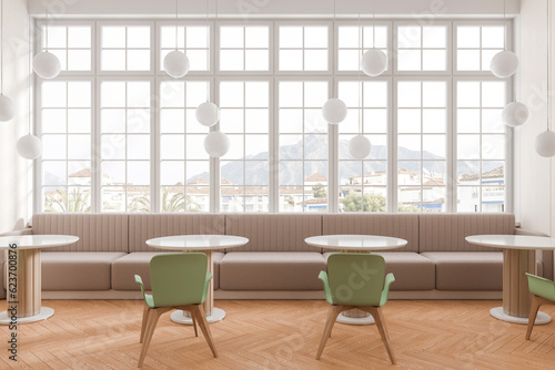 Stylish cafe interior with chairs and sofa  eating space with panoramic window