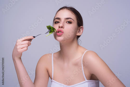 Diet plan, diet menu or program. Woman eat vegetable isolated on studio background. Weight loss detox diet. Healthy food and dieting concept. Low carb, vegan diet. Weight loss. Low calorie dieting.