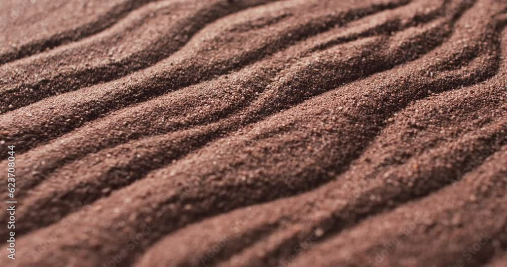 Video of close up of brown coloured sand with pattern and copy space background Video of close up of brown coloured sand with pattern and copy space background