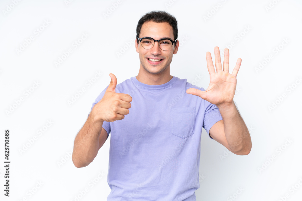 Young caucasian man isolated on white background counting six with fingers Young caucasian man isolated on white background counting six with fingers